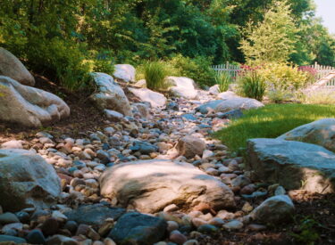 River rock and boulder garden area - out croppings with natural drainage area