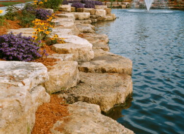 Boulder retaining wall and water 