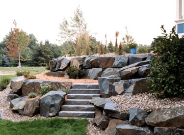 Commercial Boulder wall with stone steps