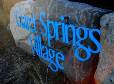 Claret Springs Village signage and boulder retaining wall