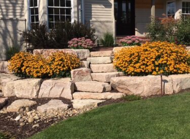 Boulder stairway and retaining wall