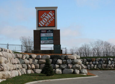 Signage and large boulder retaining wall 