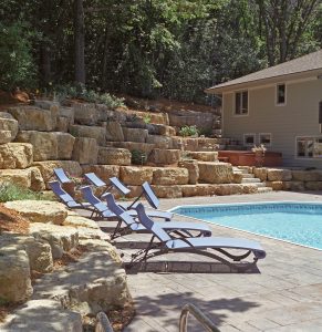 boulder retaining wall with pool