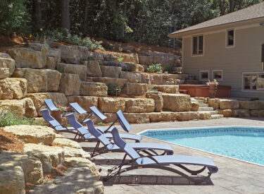 Boulder retaining wall with Pool