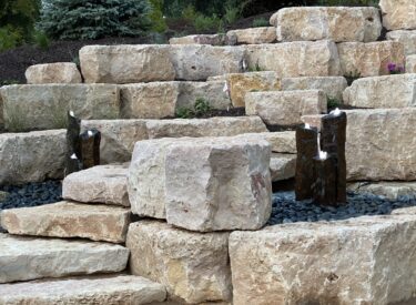 Boulder retaining walls with water feature