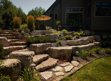 Natural Stone Stairs in Boulder retaining wall