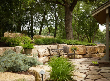 boulder retaining wall with patio
